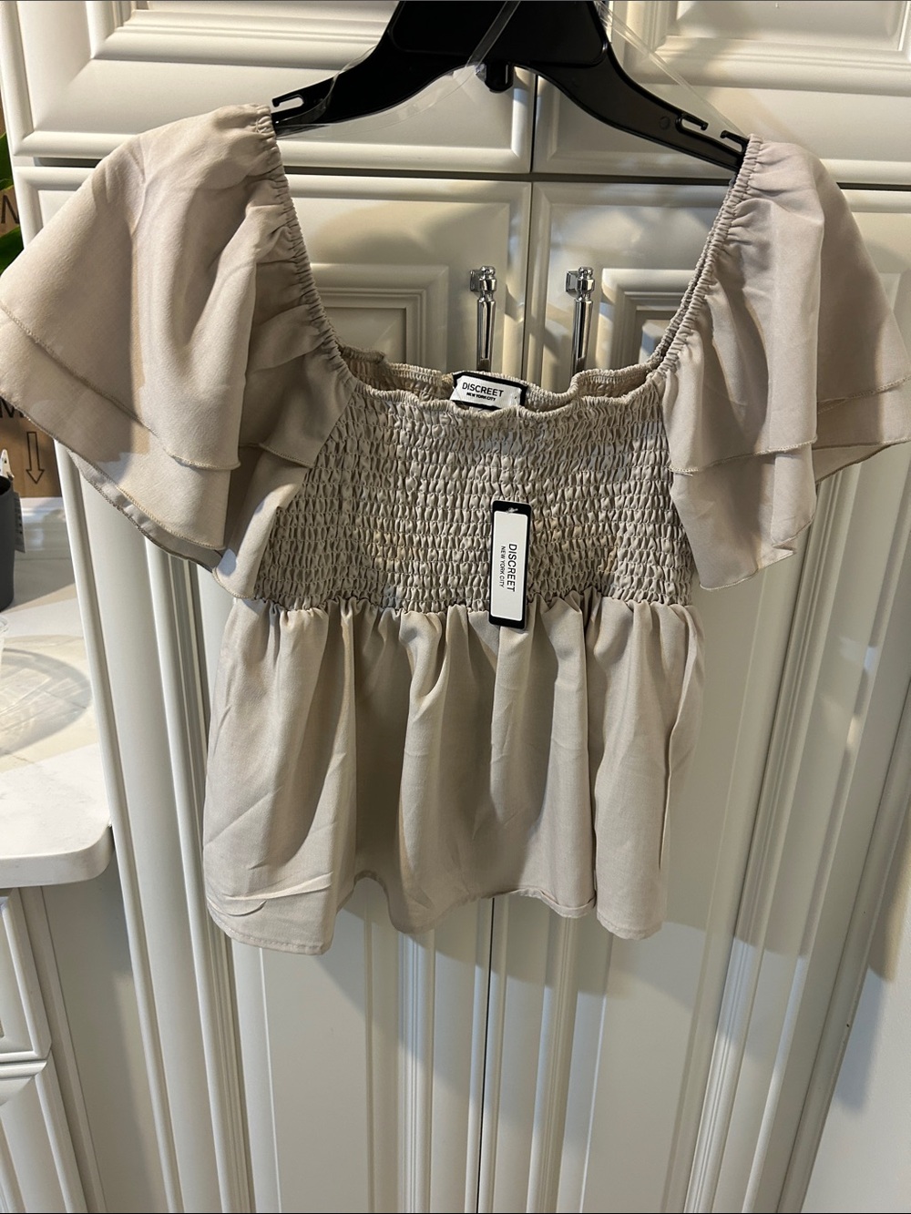 Discreet Taupe Smocked Flutter Sleeve Peplum Top